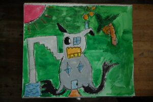 京都の絵画教室子供アトリエにて住みたい家というテーマで描いてもらった水彩画ねこが建物になっていて階段とドビラがついている